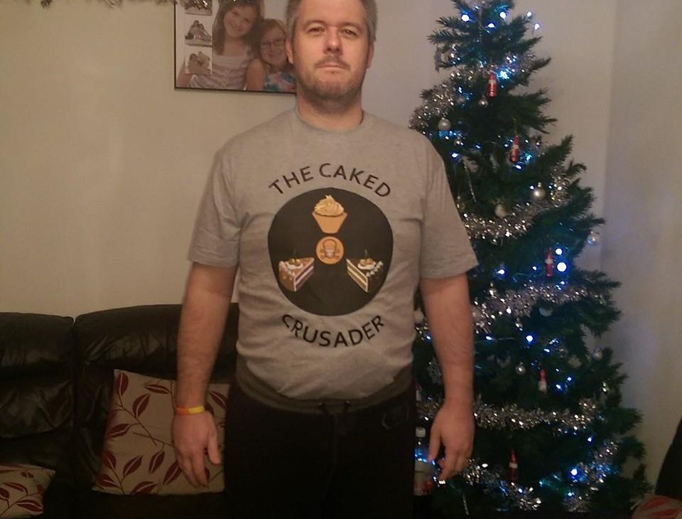 Paul wearing caked-crusader t-shirt
